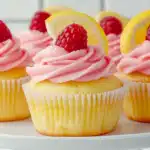 A cupcake tower filled with bright lemon cupcakes topped with colorful frosting for a festive, springtime vibe.