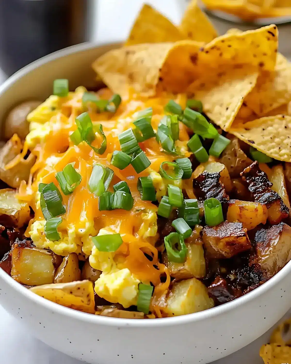 Scrambled egg bowls with cheese and potatoes

