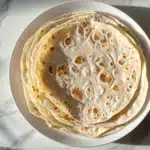 Large tortillas with charred spots on plate