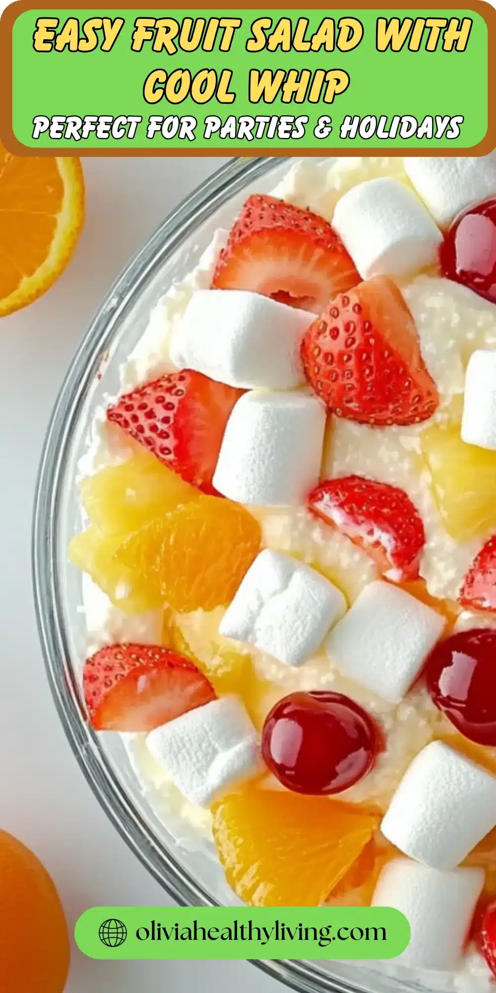 Bowl of fruit salad with Cool Whip, strawberries, oranges and marshmallows