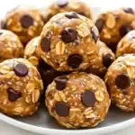 Plate full of healthy no-bake oatmeal energy balls with dark chocolate chips and chia seeds
