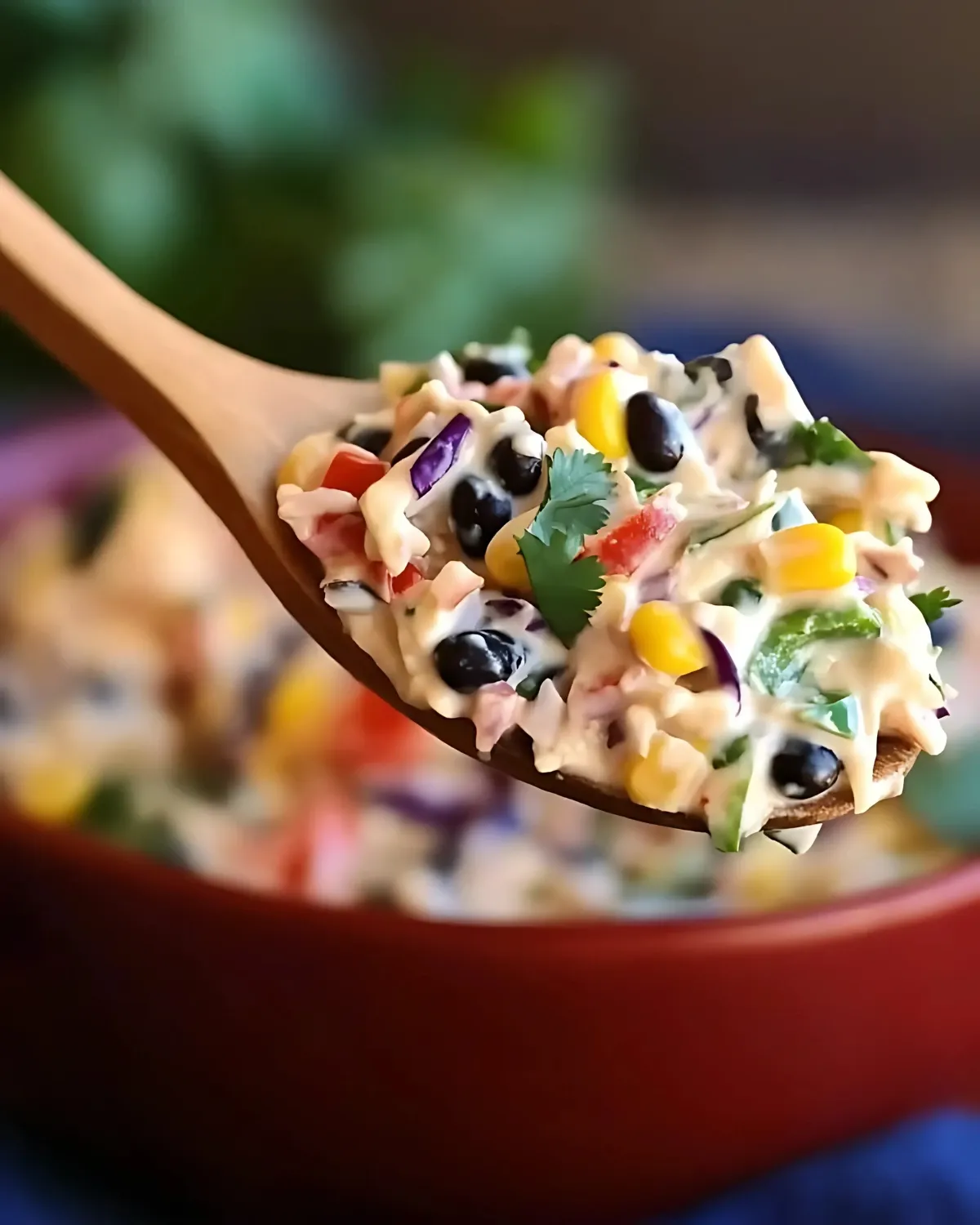 Spoonful of Mexican coleslaw with black beans