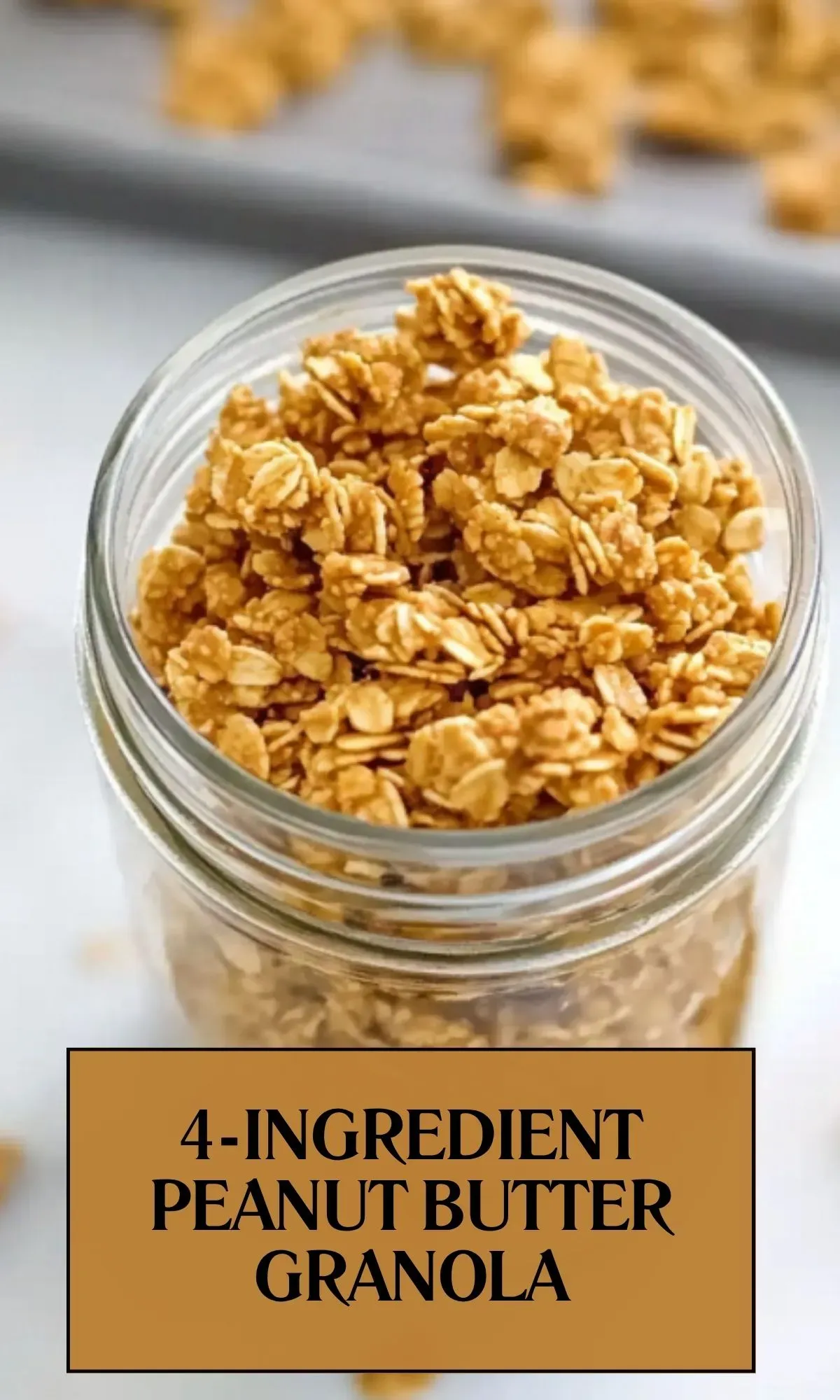 Close-up view of mason jar filled with chunky peanut butter granola made from oats, honey, peanut butter and vanilla with recipe title overlay