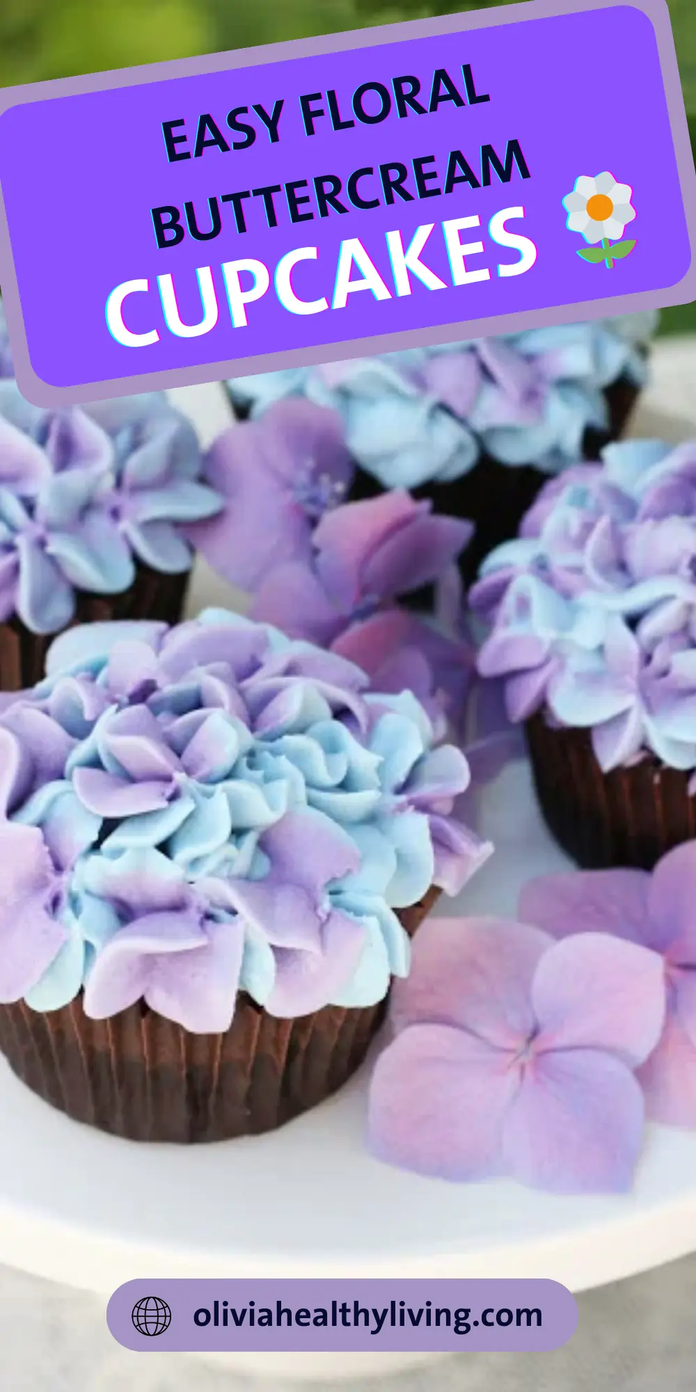 Close-up of blue and purple hydrangea cupcakes with decorative text overlay and website URL.