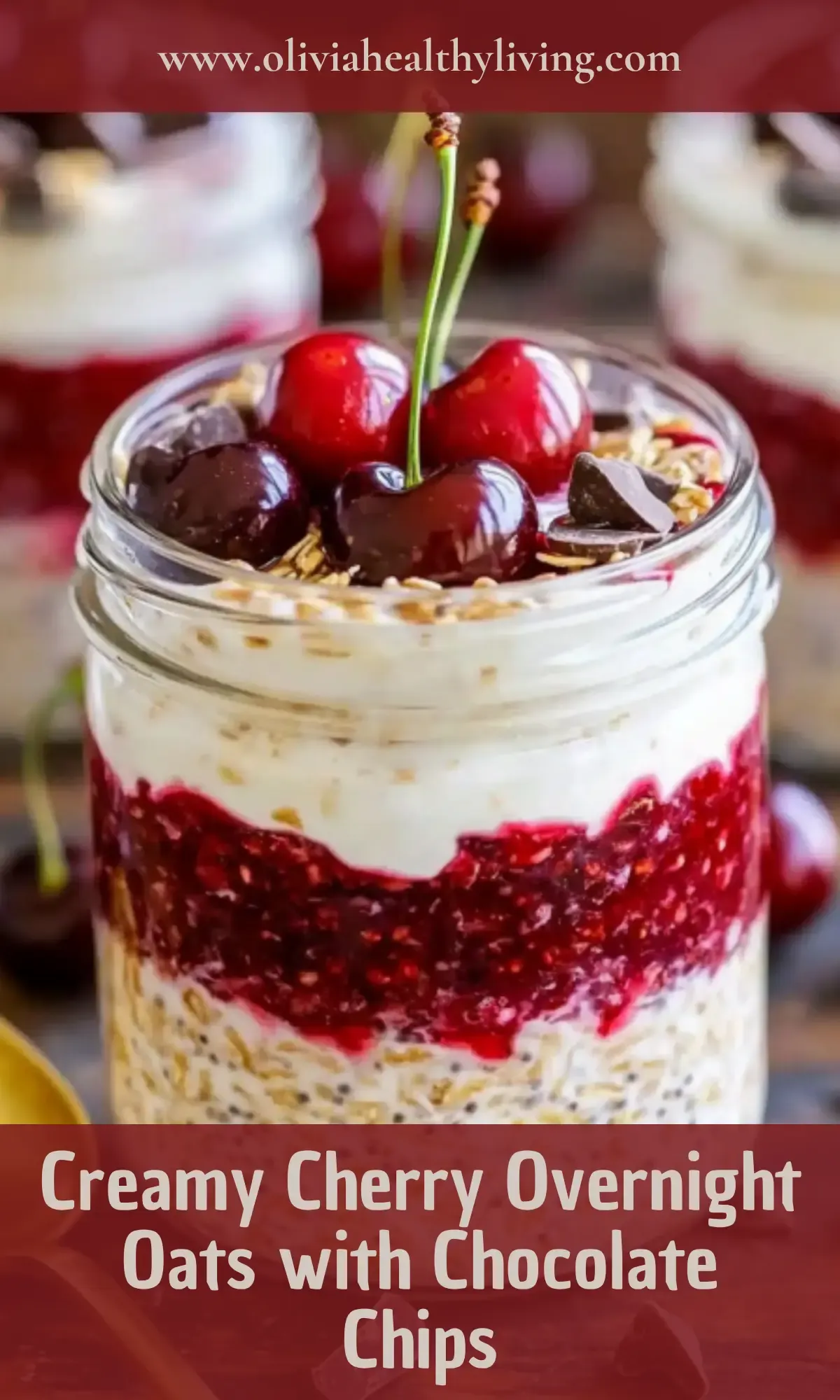 Creamy cherry overnight oats with chocolate chips in glass jar showing layers of chia oats, yogurt and cherry topping