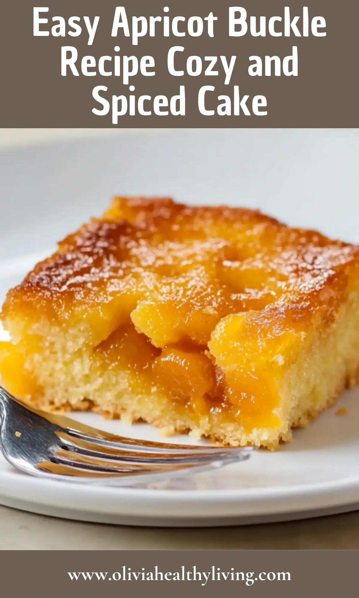 Close-up slice of apricot buckle cake showing moist crumb and caramelized apricot layer on white plate with fork