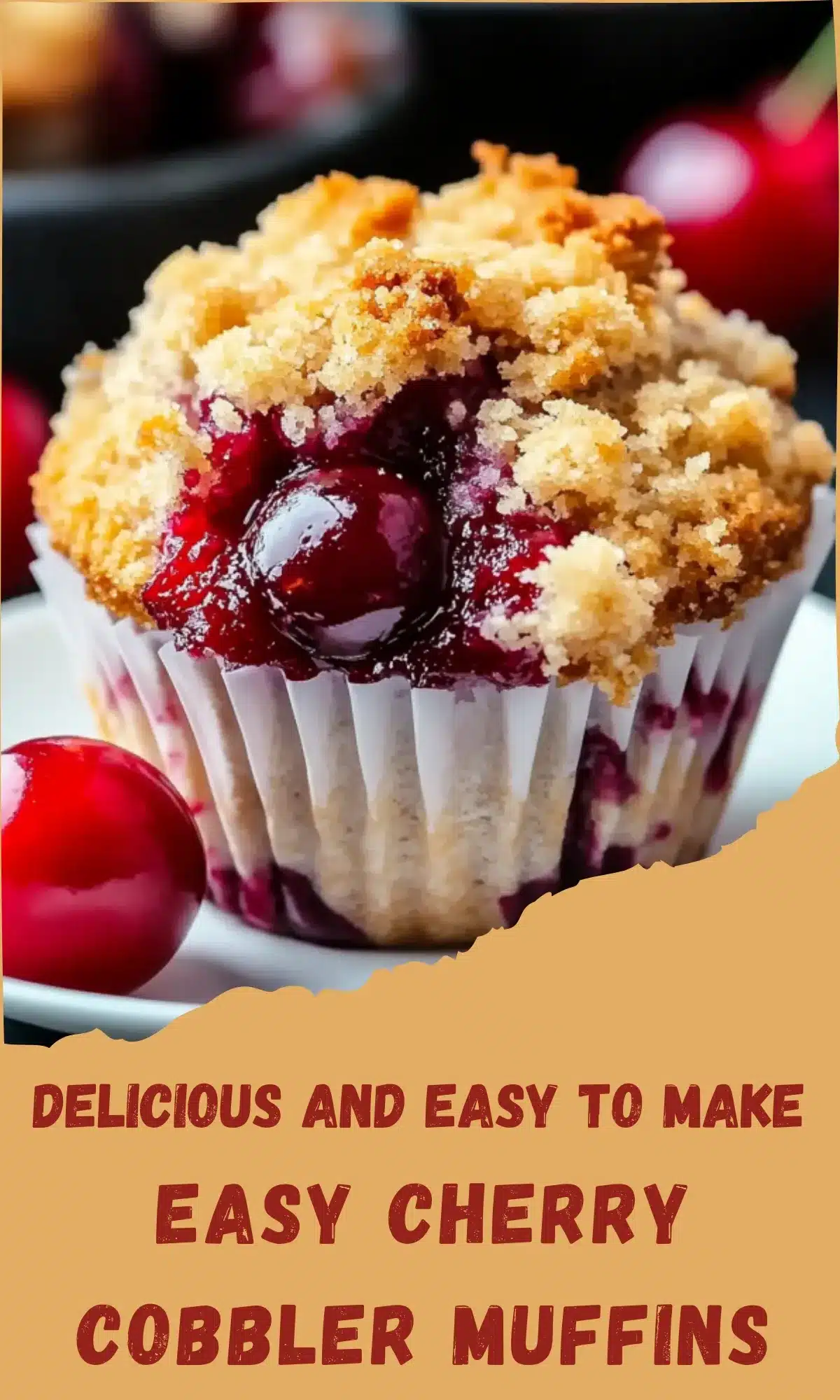 Close-up of cherry cobbler muffin with crumbly streusel topping and fresh cherries, showing delicious texture