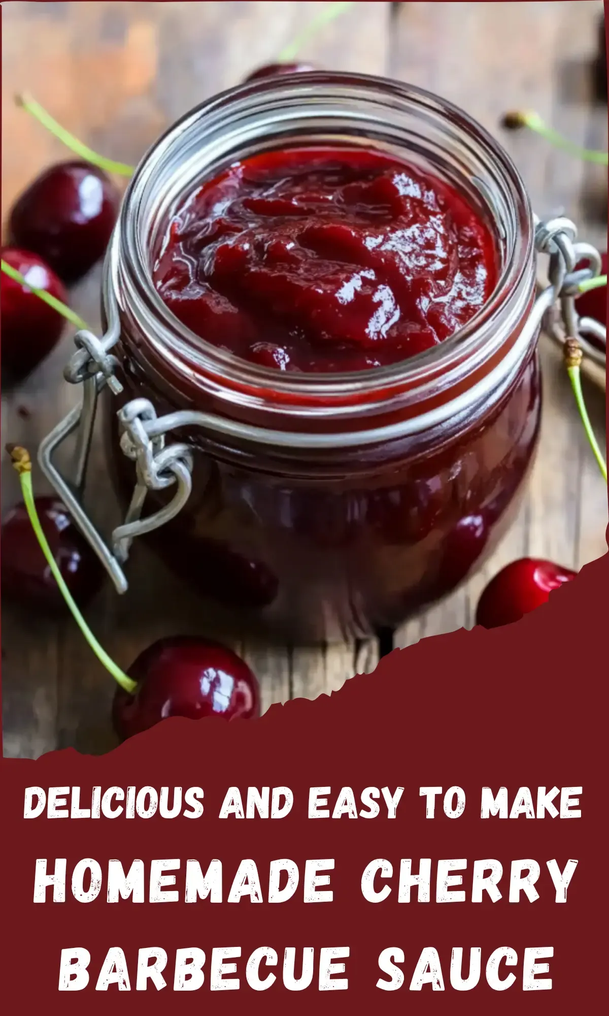 Glass mason jar with wire bail closure filled with glossy deep red cherry barbecue sauce, surrounded by fresh dark red cherries with green stems on weathered wood background, with text overlay reading "Delicious and Easy to Make Homemade Cherry Barbecue Sauce"