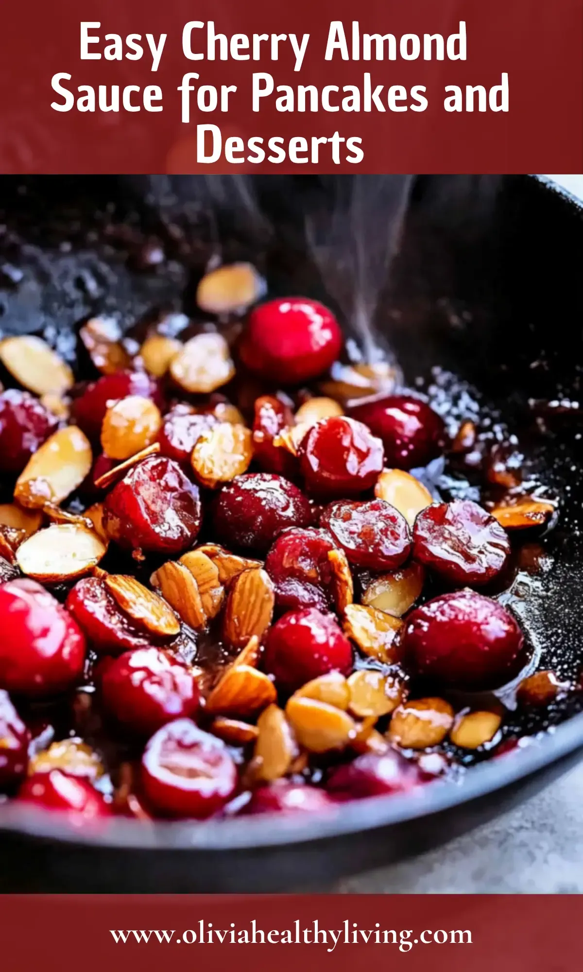 Cherry almond sauce cooking in black skillet with caramelized cherries and chopped almonds