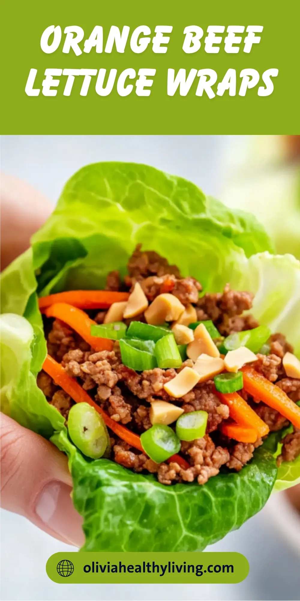 Hand holding an orange beef lettuce wrap filled with seasoned ground beef, shredded carrots, green onions, and cashews in a fresh lettuce cup