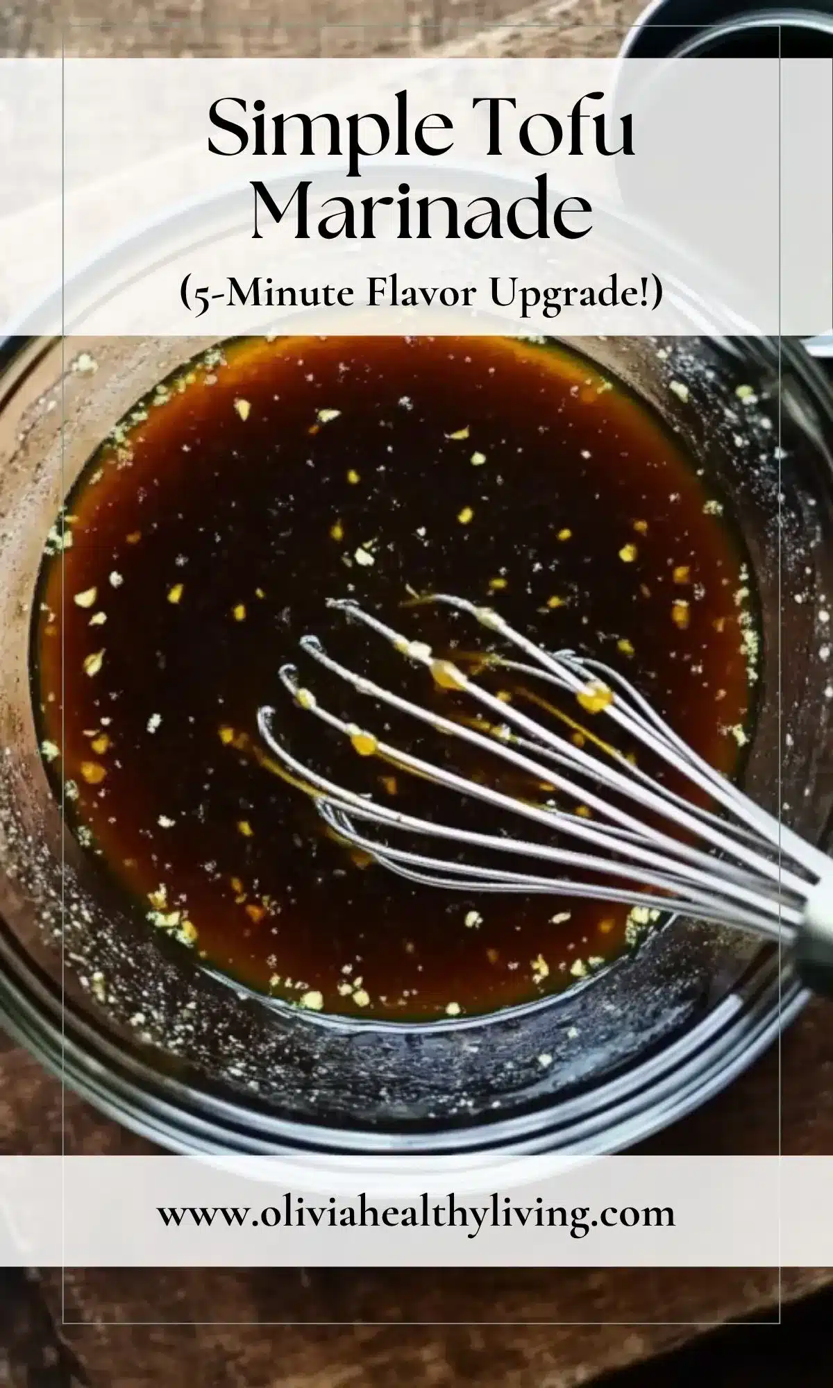Marinade in a glass bowl topped with a metal whisk, featuring soy sauce, garlic, and sesame oil, overlaid with “Simple Tofu Marinade – 5-Minute Flavor Upgrade” text for Pinterest sharing.

