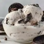 Bowl of cookies and cream ice cream with Oreo cookies and chocolate chips