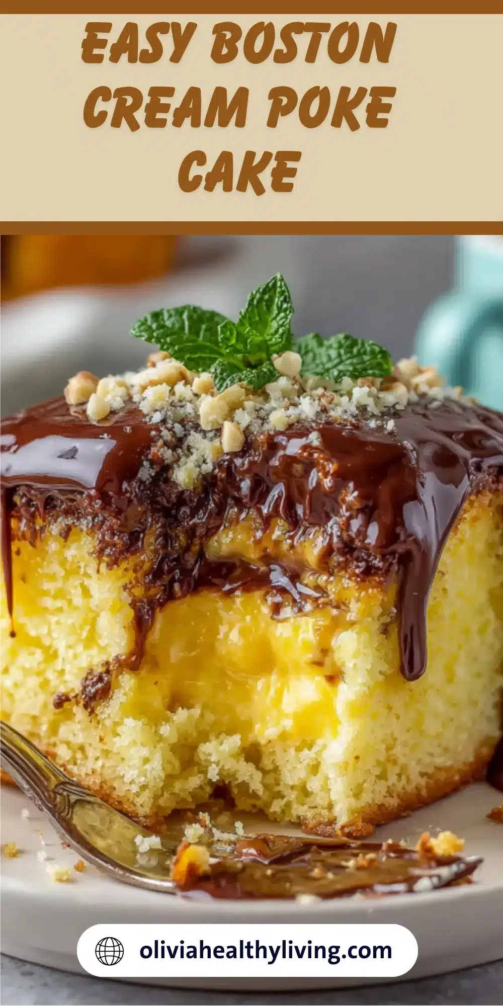 Slice of Boston cream poke cake with chocolate ganache dripping down yellow cake layers filled with pastry cream, garnished with mint and nuts