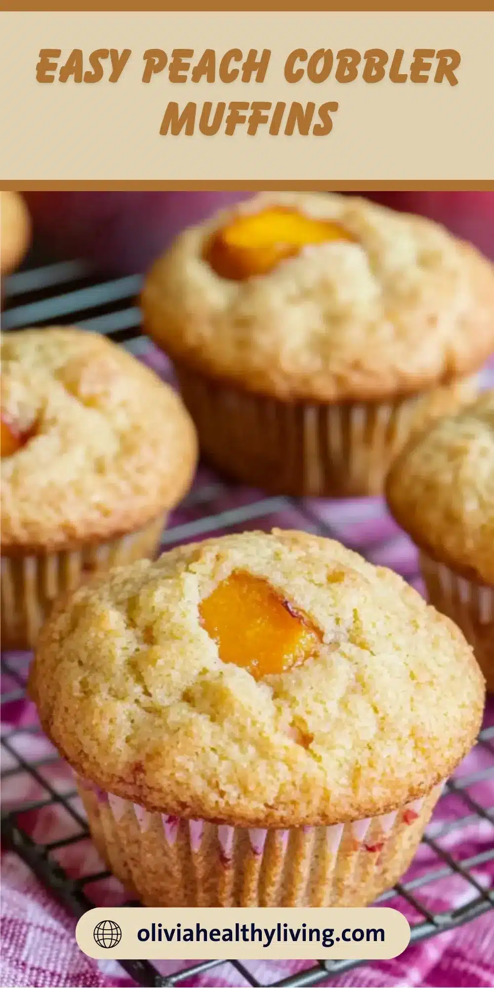 Golden peach cobbler muffins cooling on a wire rack with visible peach chunks and turbinado sugar topping