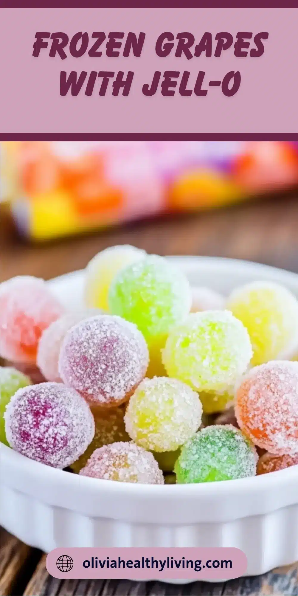 Colorful frozen grapes with Jell-O coating in various flavors arranged in a white bowl, showing the rainbow effect of different Jell-O powder coatings