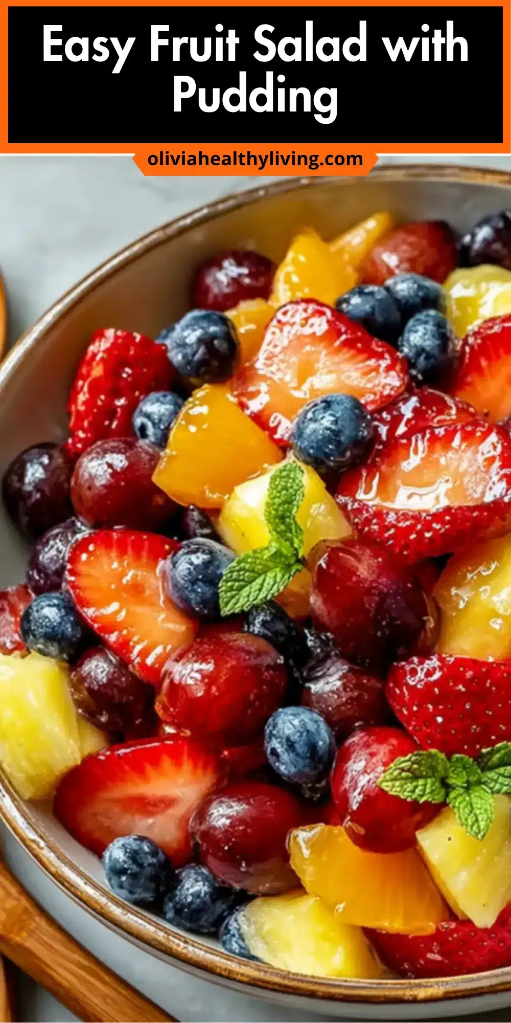 Fruit salad in ceramic bowl with title text overlay and website branding