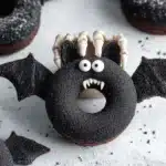 Halloween bat donut with skeleton hand, white candy fangs