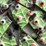 Overhead view of broken chocolate bark pieces with green chocolate