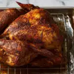 Cajun turkey on cooling rack, angled view