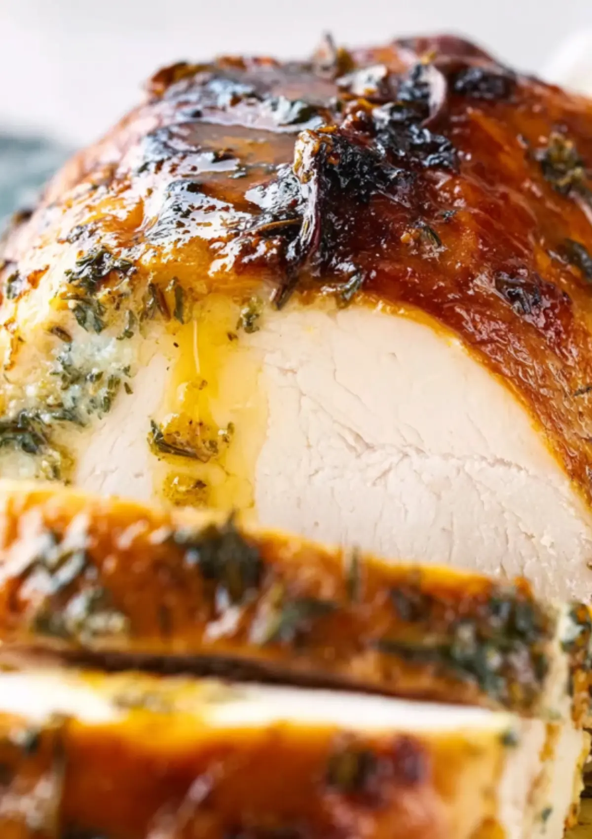 Close-up of herb-crusted turkey breast slice
