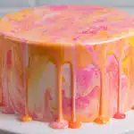 Finished marble cake with pink yellow and orange glaze