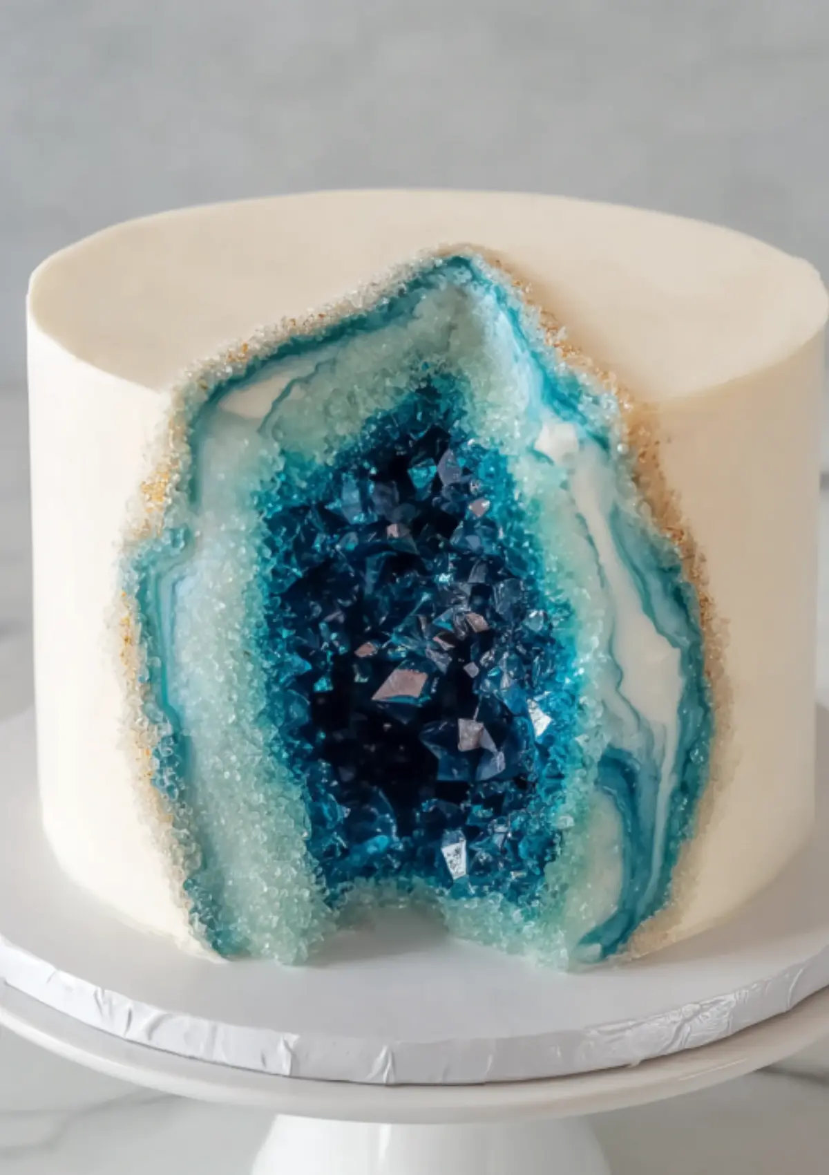Geode cake with teal crystal center closeup