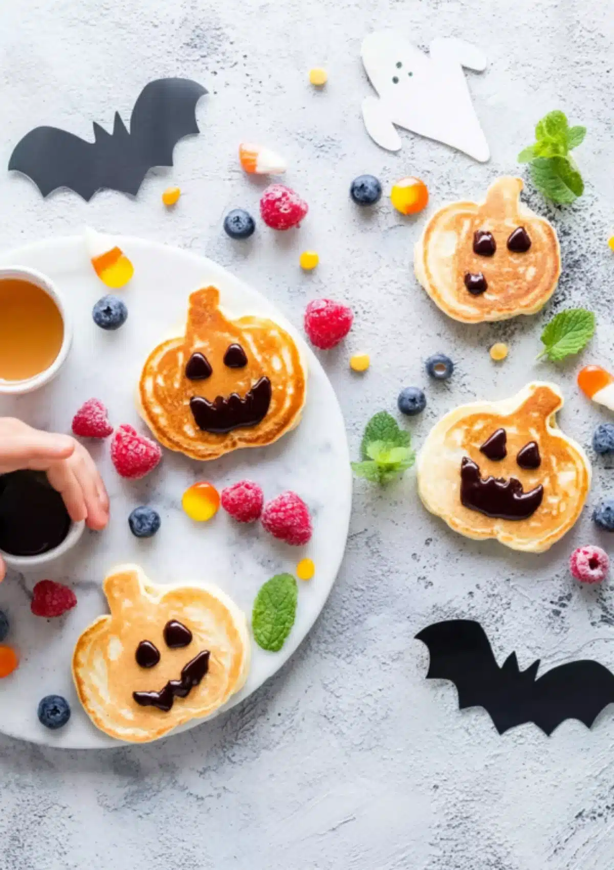 Halloween pancakes on plate with candy corn