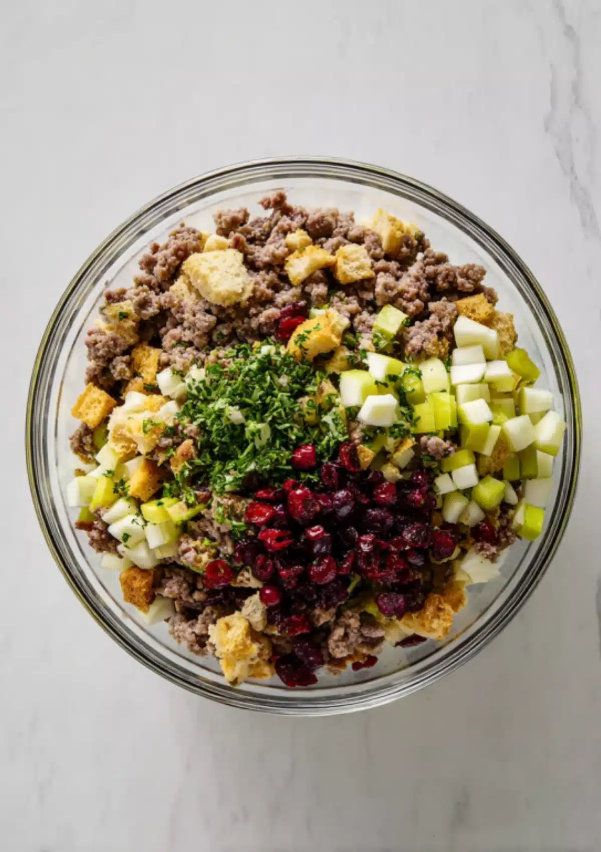 Raw stuffing ingredients in glass bowl