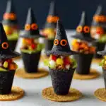 Row of three witch hat taco cones with vegetable fillings