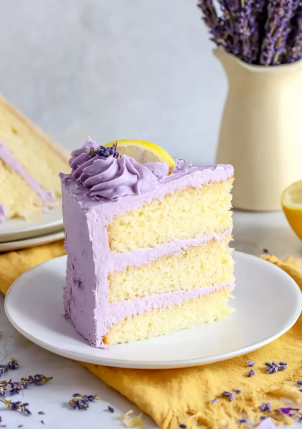 Slice of lemon lavender cake showing three layers