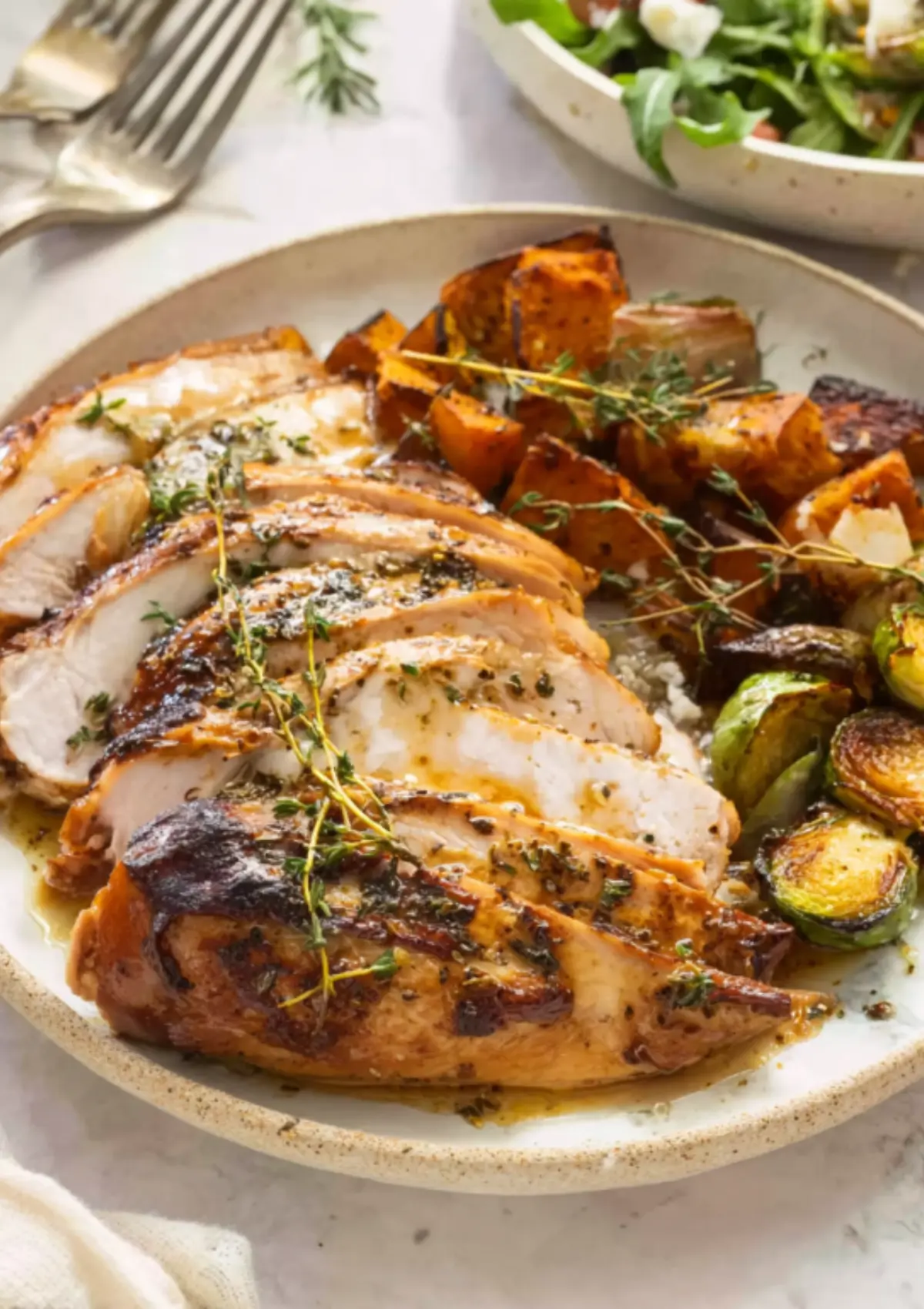 Sliced turkey breast served with roasted vegetables