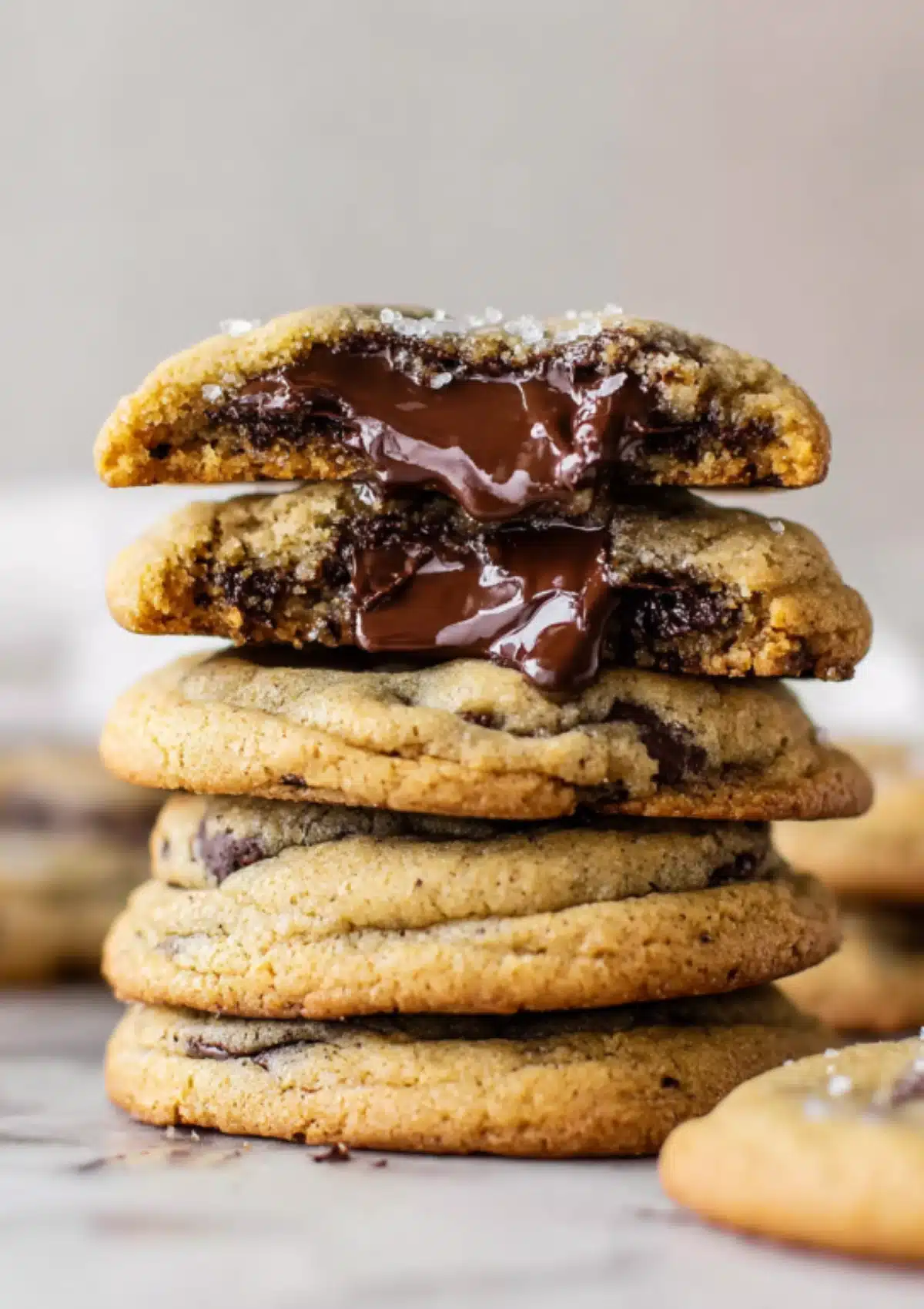 Stack of chocolate-filled cookies with melted ganache oozing out