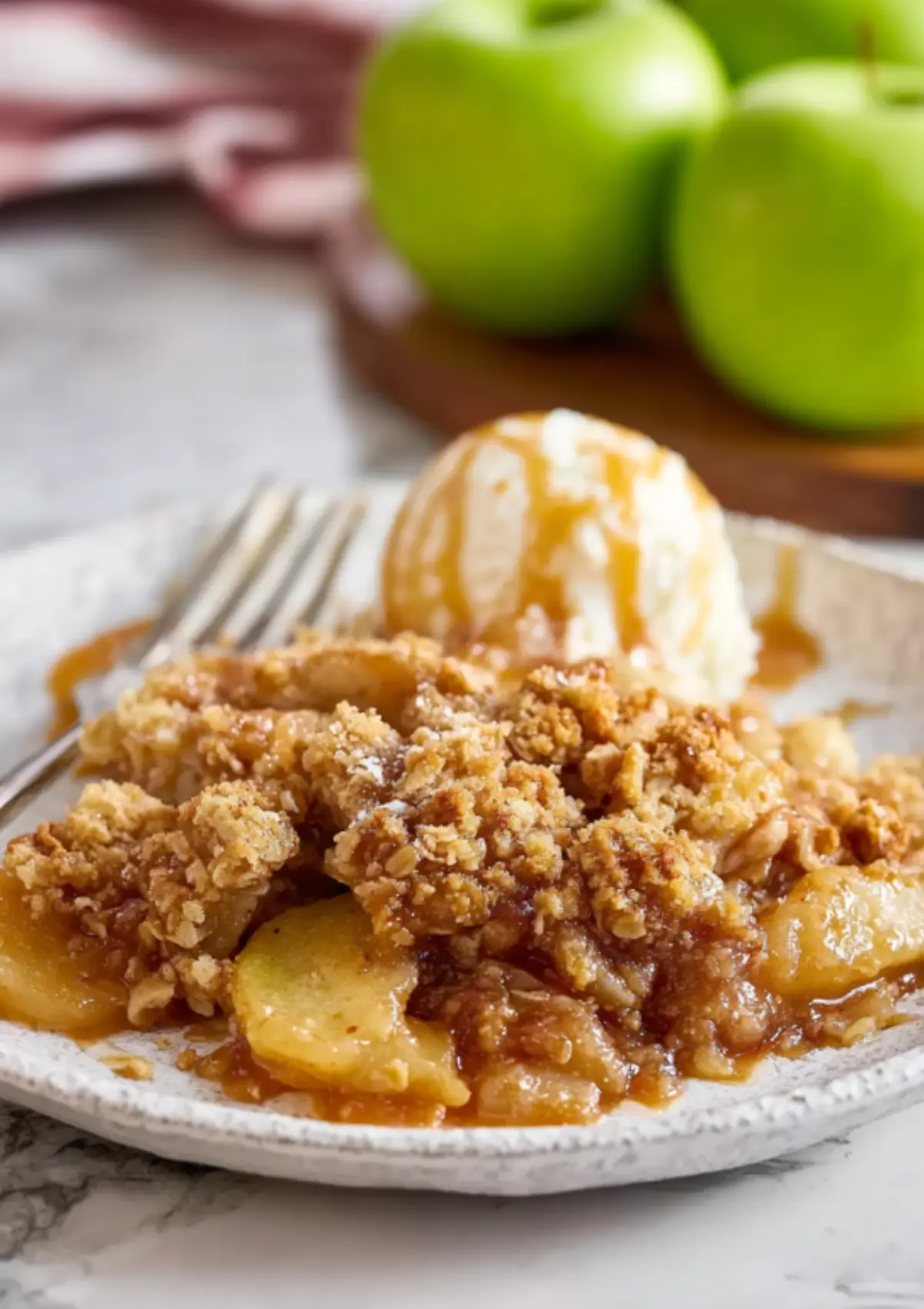 Apple crumble serving with ice cream and caramel