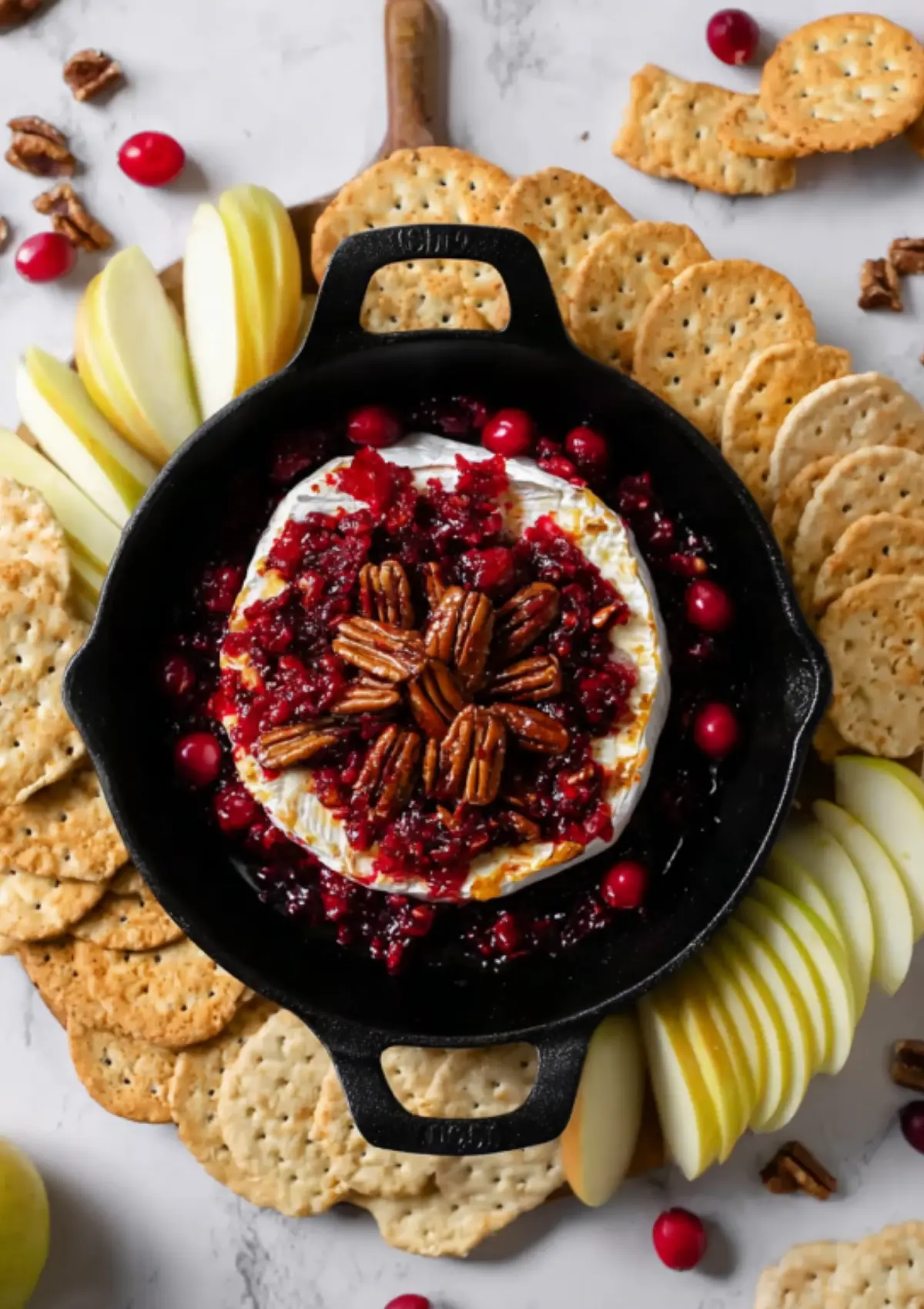Baked brie appetizer platter with crackers and apple slices