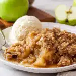 Close-up of apple crumble with ice cream