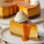 Pumpkin cheesecake slice with caramel and cream