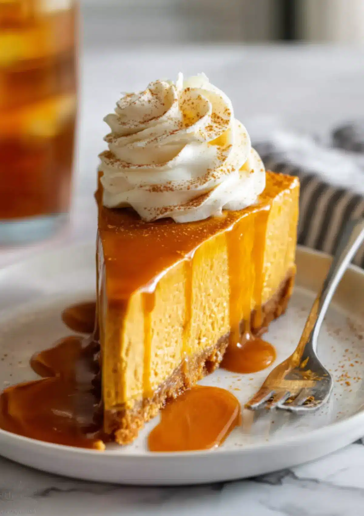 Pumpkin cheesecake with caramel dripping down sides