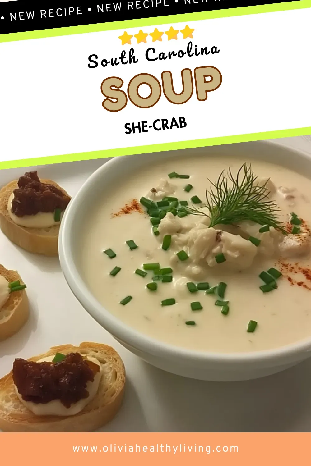 Close-up of creamy she-crab soup in white bowl garnished with fresh chives, dill sprigs, lump crabmeat, and paprika, served with bacon jam crostini on elegant white plate